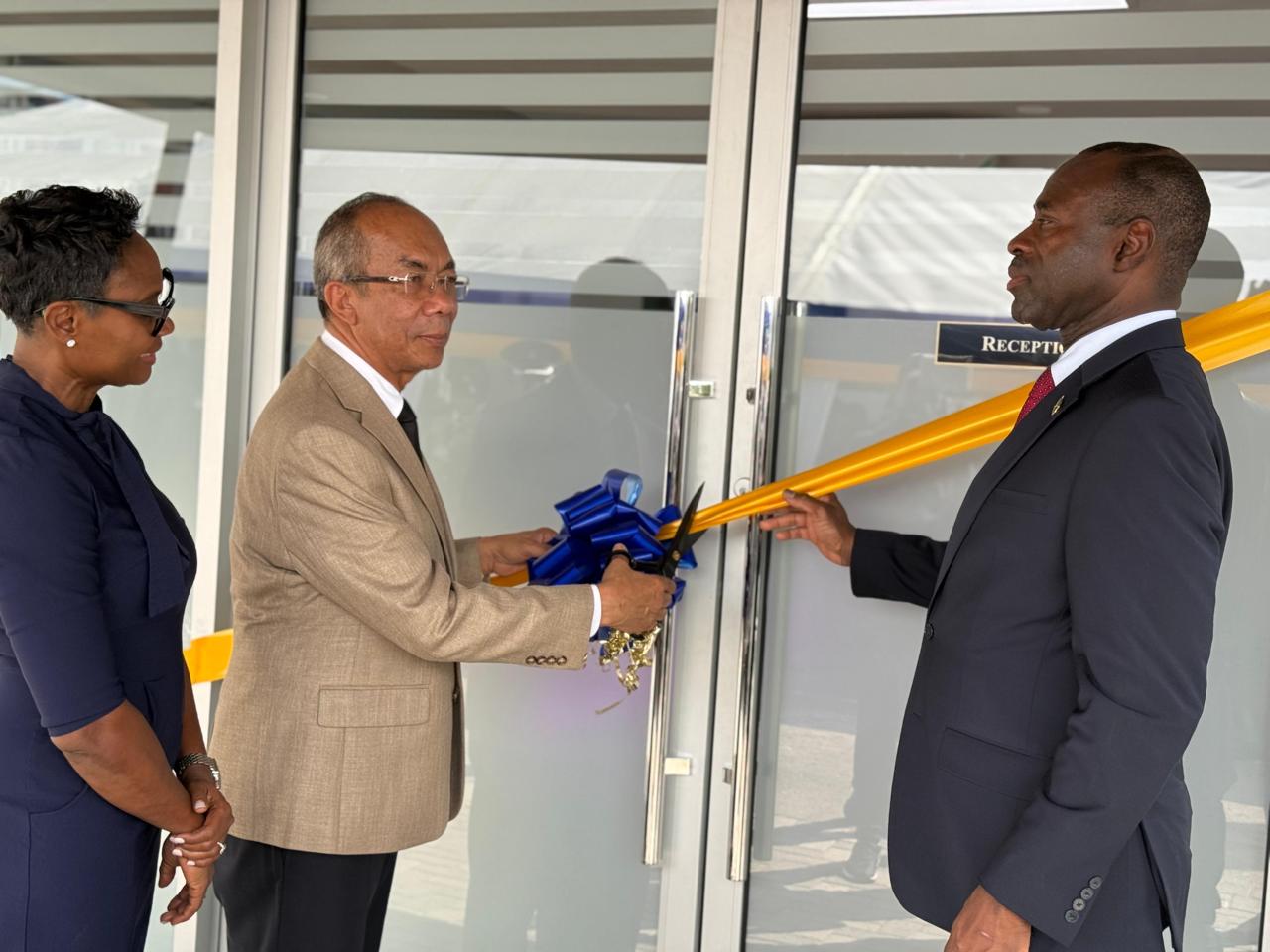 Deputy Prime Minister and Minister of National Security and Peace, the Hon. Dr. Horace Chang (1st left), cuts ribbon to signal the official opening of the Caribbean Correctional Academy on Wednesday, September 9, at 12 Worthington Terrace in Kingston.