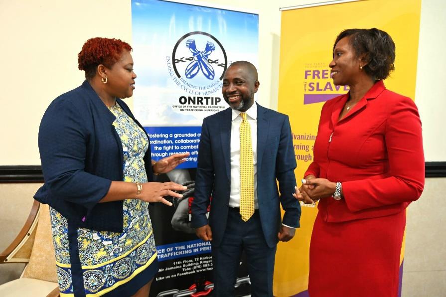 Chief Technical Director in the Ministry of National Security, Shauna Trowers (left) in conversation with National Rapporteur on Trafficking in Persons, Diahann Gordon Harrison and Executive Director of Free the Slaves, Bukeni Waruzi on Day Two of the 2024 Freedom from Slavery Caribbean Regional Forum on Trafficking in Persons at the Jamaica Pegasus Hotel. The Forum focuses on collaborative efforts to combat the transnational crime, human trafficking.
