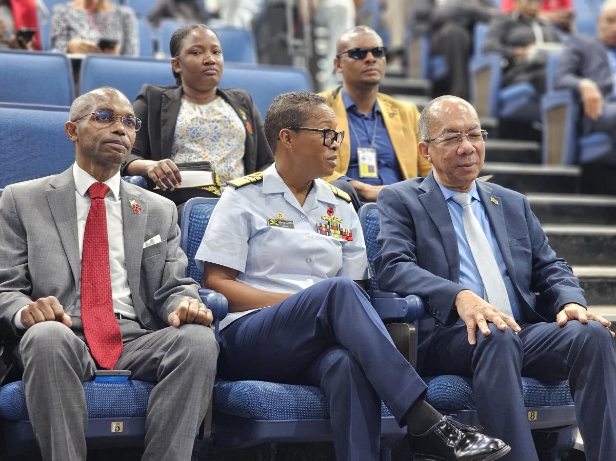 Deputy Prime Minister and Minister of National Security, the Hon. Dr. Horace Chang in conversation with Chief of Defense Staff, Vice Admiral Antonette Wemyss Gorman at the Opening Ceremony for National Cybersecurity Day held at the Caribbean Military Academy in Kingston earlier today (October 31). Permanent Secretary in the Office of the Prime Minister, Ambassador Rocky Meade looks on.
