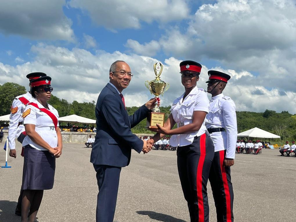 Deputy Prime Minister and Minister of National Security, the Hon. Dr. Horace Chang presents Woman Constable Zennesah Francis from Batch 150 with the award for Highest Mark Obtained. The award was given during the Jamaica Constabulary Force (JCF) Passing Out Parade and Award Ceremony, held at the National Police College of Jamaica on Wednesday, November 29, 2023. Two hundred and ninety (290) constables graduated and are now full-fledged members of the JCF.