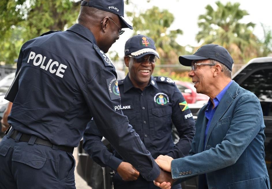 Deputy Prime Minister and Minister of National Security and Peace, the Hon. Dr. Horace Chang (right), greets Deputy Commissioner of Police Warren Clarke (left) and Commissioner of Police, Dr. Kevin Blake (centre) at the Police Area 5 Headquarters in Constant Spring, St. Andrew, on Thursday, June 4. Area 5 recorded zero murders in the first 138 days of the year.
