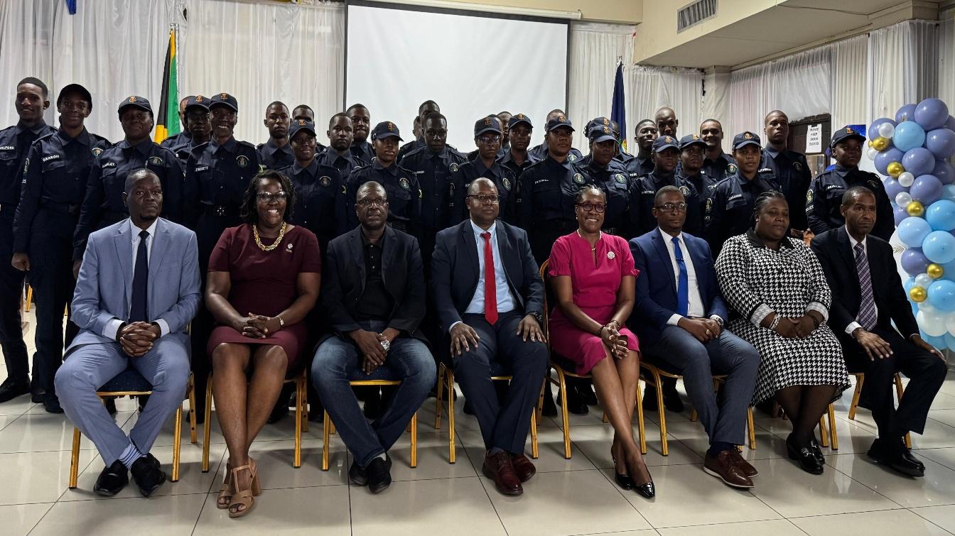 Permanent Secretary in the Ministry of National Security, Ambassador Alison Stone Roofe (seated, fourth right), shares lens with Assistant Commissioner of Police Howard Chambers (seated, fourth left), Deputy Superintendent and Senior Manager Protective Services Dainian Frater (second right), senior officers of the United District Constable Association and the cohort of thirty-three graduates at the Closing Ceremony for District Constables’ Training at the Police Officers’ Club in Kingston on Friday, August 