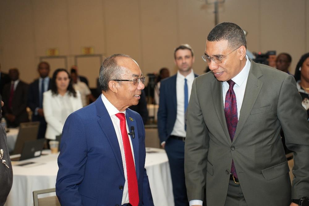 Prime Minister, the Most. Hon. Andrew Holness in conversation with Deputy Prime Minister and Minister of National Security, the Hon. Dr. Horace Chang at the 2024 National Security Seminar held at the AC Hotel by Marriott in Kingston today (February 7).