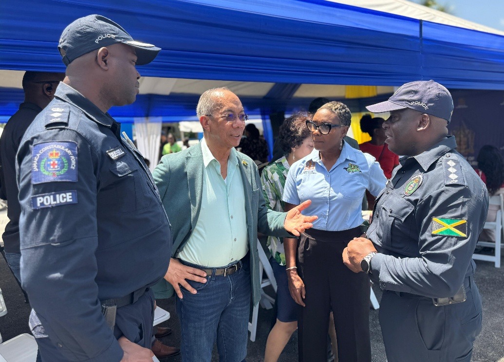 Deputy Prime Minister and Minister of National Security, the Hon. Dr Horace Chang (second left) in discussion with Minister of State Hon. Juliet Cuthbert Flynn (second right), Area One Second in Command, Snr. Superintendent Carlos Russell (left) and Commanding Officer, Property Management and Maintenance Division (PMMD) Acting Superintendent Joel Hamilton, at the opening ceremony for the newly built Anchovy Police Station in St. James on Tuesday, August 5.