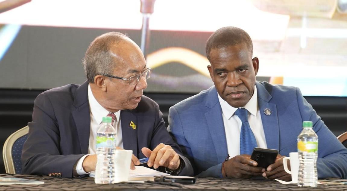 Deputy Prime Minister and Minister of National Security, the Hon. Dr. Horace Chang, in conversation with Dr. Kevin Blake, Commissioner of Police, on day one of the 82nd Annual Joint Central Conferences of the Jamaica Police Federation yesterday (May 27) at Princess Grande Hotel in Hanover.