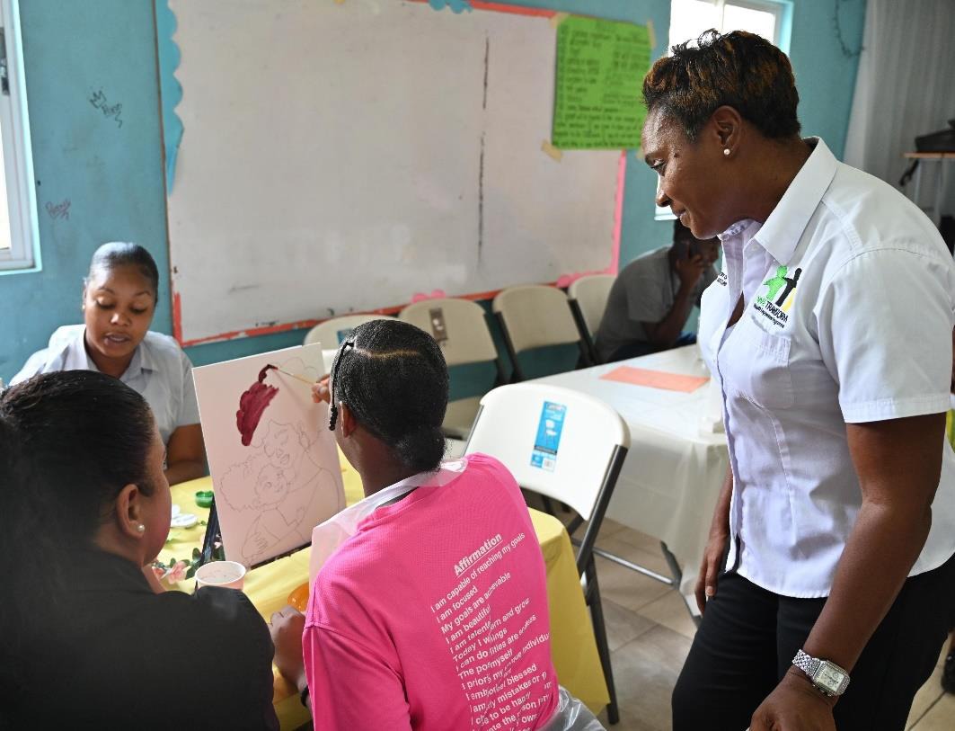 Minister of State in the Ministry of National Security, the Hon. Juliet Cuthbert-Flynn observes as a ward and her mentor participate in a ‘Sip and Paint’ activity hosted at the South Camp Juvenile Correctional and Remand Centre earlier today (May 9). The event was organised under the We Transform Youth Empowerment Programme and is being held in celebration of Child’s Month and Mother’s Day
