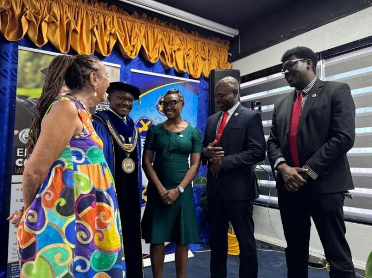 Minister of State in the Ministry of National Security, the Hon. Juliet Cuthbert-Flynn (centre) shares a moment with Commissioner of Corrections, Brigadier (Ret’d) Radgh Mason (second right), Deputy Commissioner of Corrections, Rehabilitation and Probation Aftercare, Dr. Marc Thomas (first right), President of the University of the Commonwealth Caribbean, Professor Colin Gyles (second left), and Executive Director of Stand Up For Jamaica, Maria Carla Gullotta at the University of the Commonwealth Caribbean 