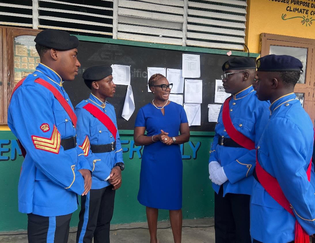Minister of State in the Ministry of National Security, the Hon. Juliet Cuthbert-Flynn in conversation with St. Mary High School Cadets at the Jamaica Combined Cadet Force (JCCF) Ruel Vaz Trophy Presentation Parade yesterday (July 1) held at St. Mary High School. St. Mary High Cadets copped the Ruel Vaz Trophy for the 17th time in the history of the competition.