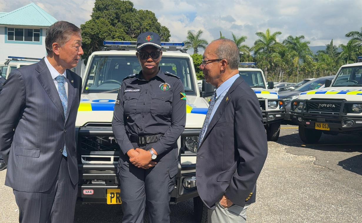 Deputy Prime Minister and Minister of National Security, the Hon. Dr. Horace Chang in conversation with Ambassador of Japan, His Excellency Yasuhiro Atsumi and Deputy Commissioner of Police Karina Powell-Hood at the Handover Ceremony for 27 Toyota Land Cruiser Pickup Trucks donated by the Government of Japan. The event was held at the Office of the Commissioner of Police earlier today (December 10).
