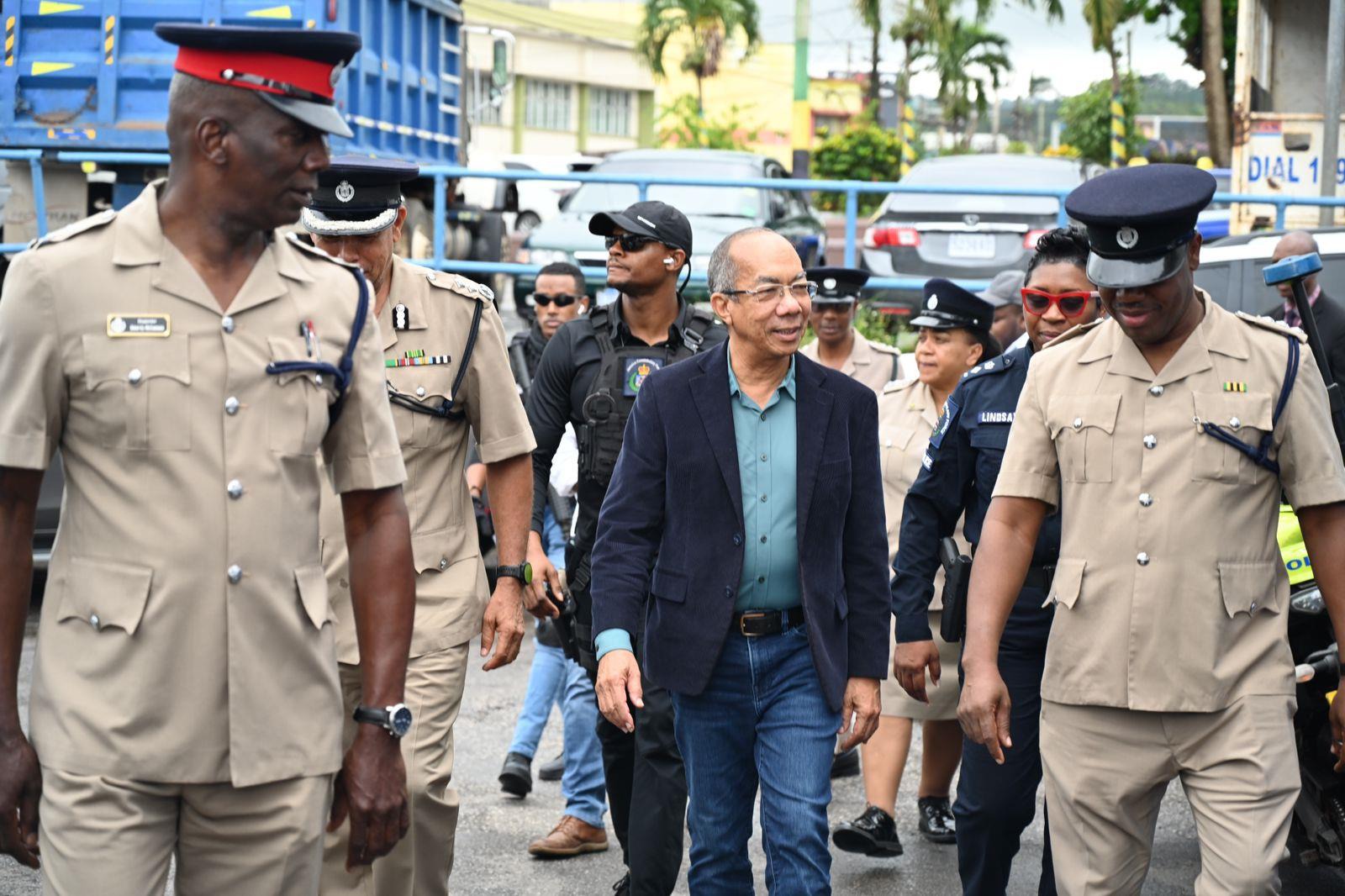 Deputy Prime Minister and Minister of National Security, the Hon. Dr. Horace Chang, Deputy Commissioner of Police Clifford Blake and other senior members of the Jamaica Constabulary Force met at the Mandeville Police Station ahead of a tour of the Mandeville market and the communities of Albion and May Day in the parish yesterday (October 17). The visit sought to reassure residents that the security forces are working assiduously to maintain and restore peace and public order in the parish.