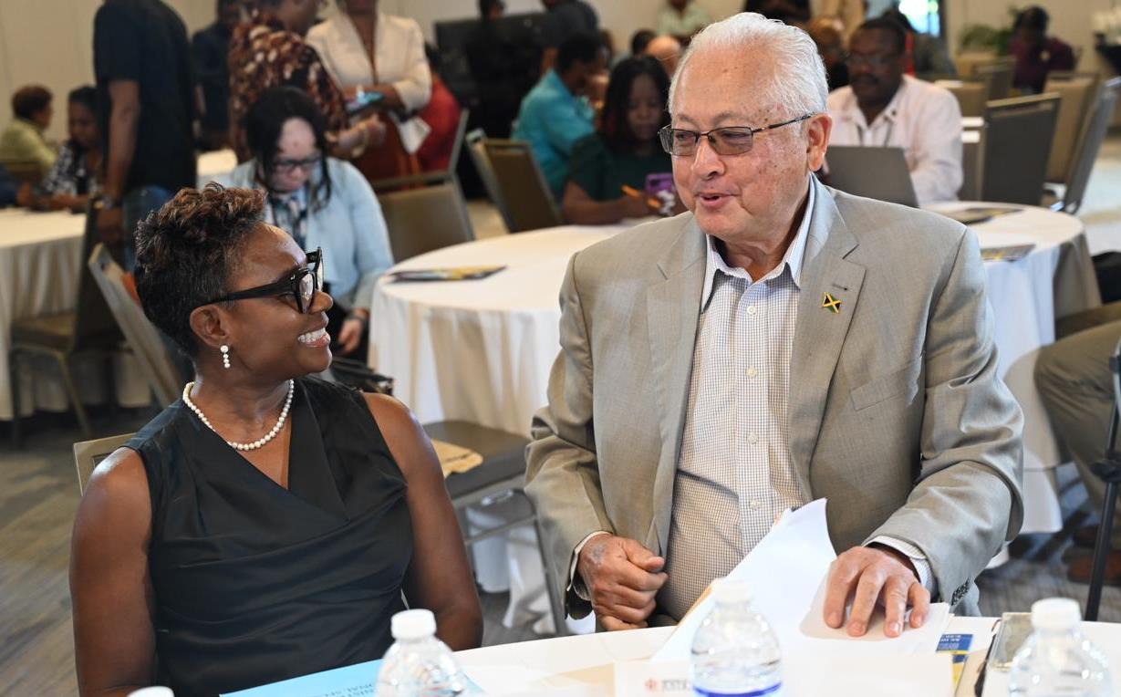 Minister of State in the Ministry of National Security, the Hon. Juliet Cuthbert-Flynn in conversation with Minister of Justice, the Hon. Delroy Chuck at the Restorative Justice Policy Forum held at the AC Hotel in Kingston earlier today (November 20). The Restorative Justice Policy Forum invited discourse on the post sentence aspect of the policy.