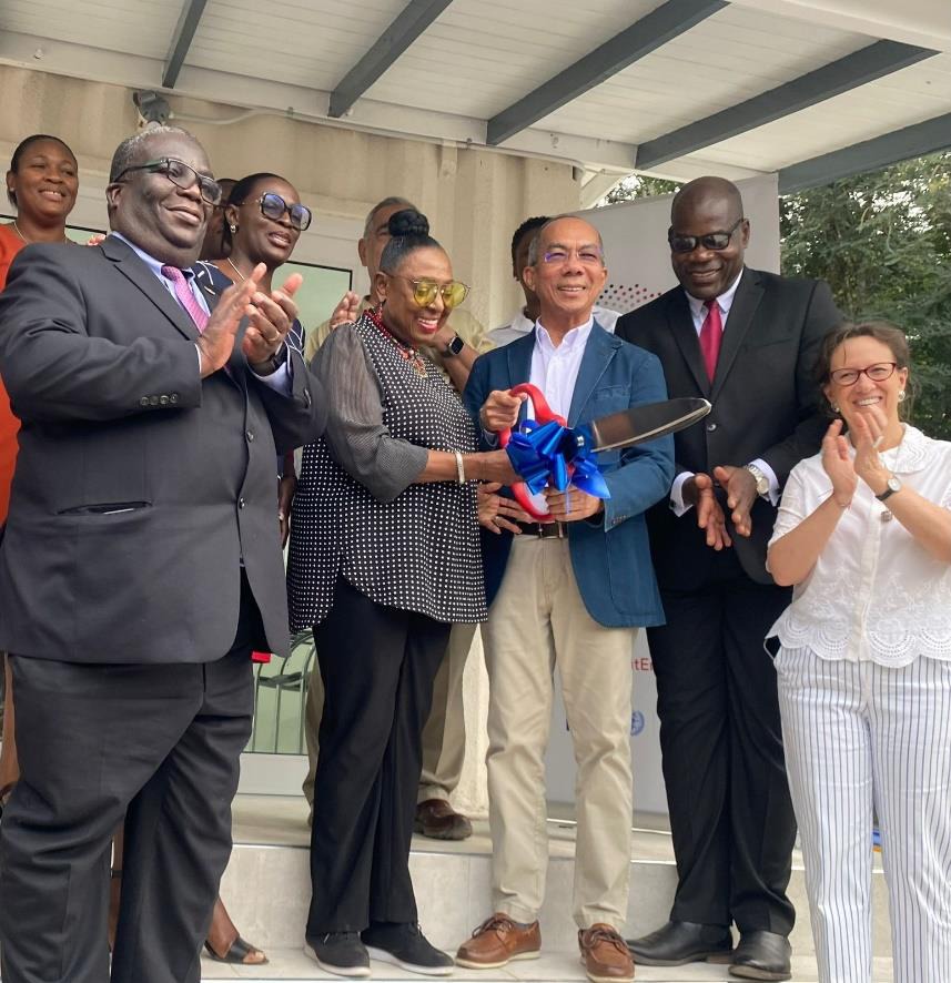 Deputy Prime Minister and Minister of National Security Hon. Dr. Horace Chang (centre), Minister of Culture, Gender, Entertainment and Sport, Hon. Olivia Grange (second-left), Deputy Commissioner of Police Fitz Bailey(second-right), UNICEF Country Representative Olga Isaza (first-right), United Nations Resident Coordinator, Dennis Zulu(first-left) and other senior officials during the ribbon cutting at the handing over ceremony for the CISOCA One Stop Victim Centre in May Pen, Clarendon today (December 13).