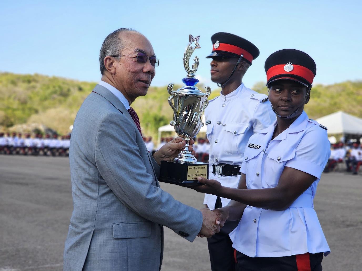 Deputy Prime Minister and Minister of National Security, the Hon. Dr. Horace Chang presents Constable Anecea Salmon from Batch 158 with the award for Best All Round Performance Obtained. The award was given during the Jamaica Constabulary Force (JCF) Passing Out Parade and Award Ceremony, held at the National Police College of Jamaica on Friday (March 21).