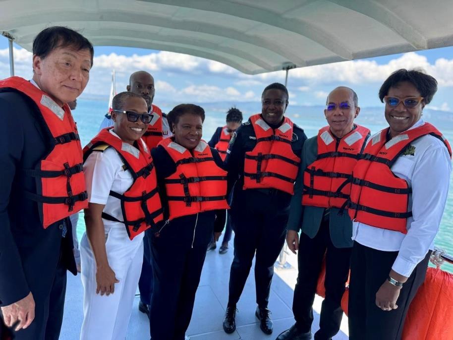 Deputy Prime Minister and Minister of National Security, the Hon. Dr. Horace Chang (second right) shares a moment with Ambassador of Japan to Jamaica, His Excellency Yasuhiro Atsumi (first left) while exploring the Kingston Harbour on one of the newly donated Inshore Patrol Vessels from the Government of Japan to Jamaica yesterday (April 10). Looking on are Permanent Secretary in the Ministry of National Security, Ambassador Alison Stone Roofe (first right), Chief of Defence Staff, Vice Admiral Antonette We