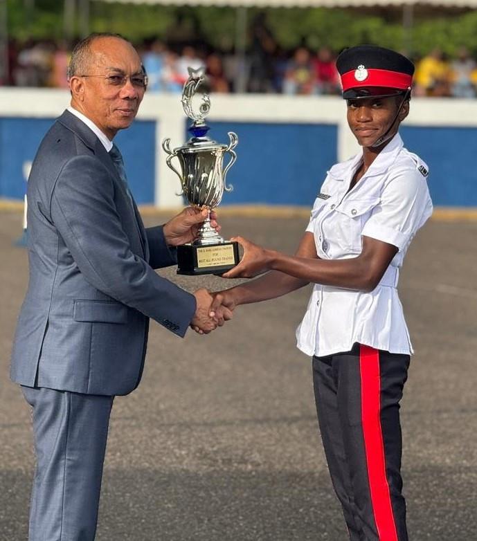 Deputy Prime Minister and Minister of National Security, the Hon. Dr. Horace Chang presents Constable Sherwette Watson from Batch 156 with the award for Highest Mark Obtained. The award was given during the Jamaica Constabulary Force (JCF) Passing Out Parade and Award Ceremony, held at the National Police College of Jamaica yesterday (December 6).