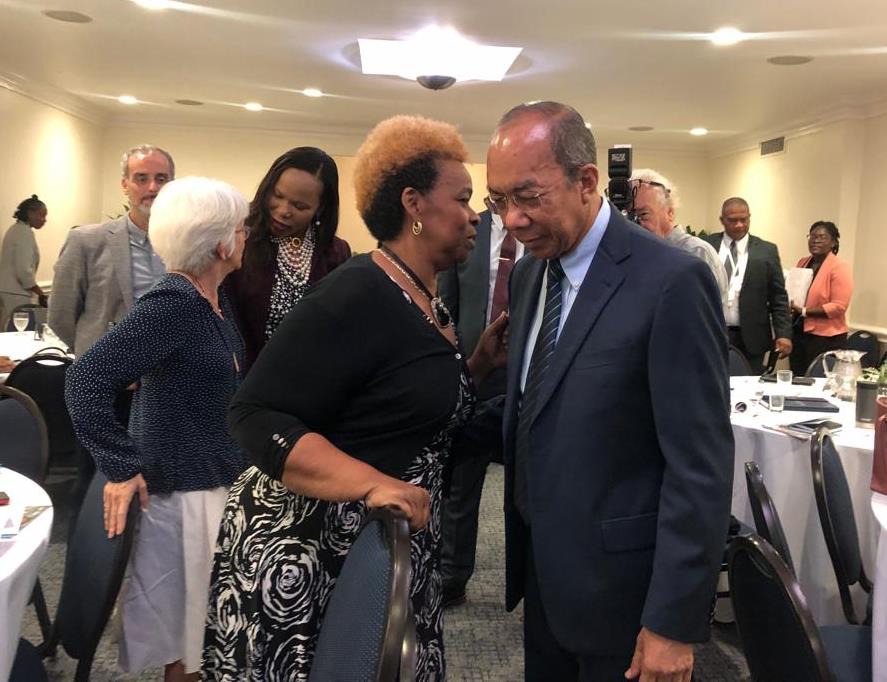 Photo caption: Deputy Prime Minister and the Minister of National Security, the Hon. Dr. Horace Chang converses with the Executive Director of the Citizen Security Secretariat, Dianne McIntosh about the government's commitment to social investment during the Opening Session of the Citizen Security Secretariat Three-Day Retreat at the Courtleigh Hotel in Kingston this morning (July 11).