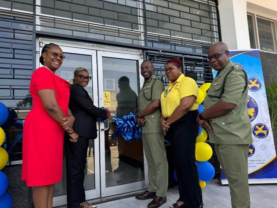 Minister of State in the Ministry of National Security, the Hon. Juliet Cuthbert-Flynn (2nd left) and Commissioner of Corrections, Brigadier (Ret’d) Radgh Mason (3rd right) cut the ribbon to officially open the new Department of Correctional Services (DCS) Recruitment and Training Centre in Kingston on Friday (June 20). Permanent Secretary, Ambassador Alison Stone Roofe (left), Chief Technical Director, Shauna Trowers and Director of Security in the DCS, Superintendent Denis Waysome, also participated in th