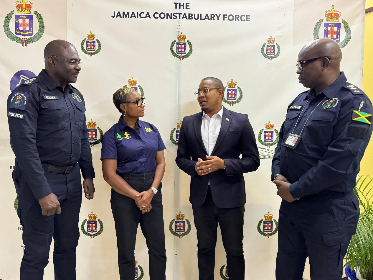 Minister of State in the Ministry of National Security, the Hon. Juliet Cuthbert-Flynn (second left) in conversation with Minister of Agriculture, Fisheries and Mining, the Hon. Floyd Green (second right) at the launch of the Jamaica Constabulary Force Agricultural Protection Branch held at the Tactical Training Academy today (June 13). Deputy Commissioner of Police, Warren Clarke, (first left) and Acting Assistant Commissioner of Police, Oral Pascoe (first right) look on.