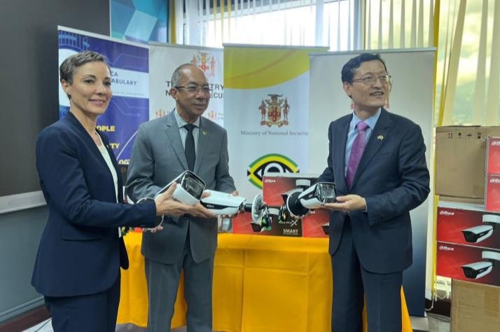 Photo caption: Deputy Prime Minister and Minister of National Security, the Hon. Dr. Horace Chang (centre), Minister of Foreign Affairs and Foreign Trade, Senator the Hon. Kamina Johnson Smith and Chargé d' Affairs, Embassy of the Republic of Korea, Mr. Jin-wook Kim examine surveillance cameras handed over today from the Government of Korea to Jamaica. Over 200 cameras were donated by the Republic of Korea, to aid Jamaica's fight against public disorder and crime, as part of the JamaicaEye Programme.