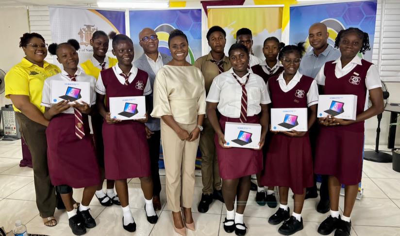 Minister of State in the Ministry of National Security, the Hon. Juliet Cuthbert-Flynn shared a moment with students from the Denham Town High School in Kingston today (November 3) after presenting them with tablets donated by e-Learning Jamaica. Chief Executive Officer of e-Learning Jamaica, Andrew Lee (left), Councillor for West Kingston, Jermaine Hyatt (right) and Chief Technical Director in the Ministry of National Security, Shauna Trowers, also participated in the handing over ceremony.