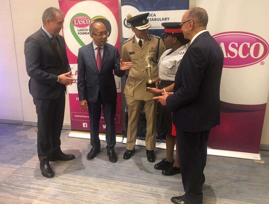 Deputy Prime Minister and Minister of National Security, the Hon. Dr. Horace Chang and Commissioner of Police, Major General Antony Anderson congratulate the LASCO Chin Foundation Police of the Year, Woman Constable Jayann Raymond at the Lasco Chin Foundation/JCF Saluting Our Heroes Awards Ceremony at the AC Marriott Hotel in Kingston. John De Silva, Managing Director, LASCO Distributors Limited (left) and James Rawle, Executive Chairman, LASCO Chin foundation (right) share the moment.