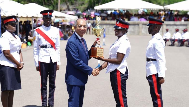 Deputy Prime Minister and Minister of National Security, the Hon. Dr. Horace Chang presents Woman Constable Neliece Poyser-Robinson from Batch 148 with the award for Highest Mark Obtained. The award was given during the Jamaica Constabulary Force (JCF) Passing Out Parade and Award Ceremony, held at the National Police College of Jamaica on Friday, September 29, 2023. Two hundred fifty-seven (257) constables graduated and are now full-fledged members of the JCF.