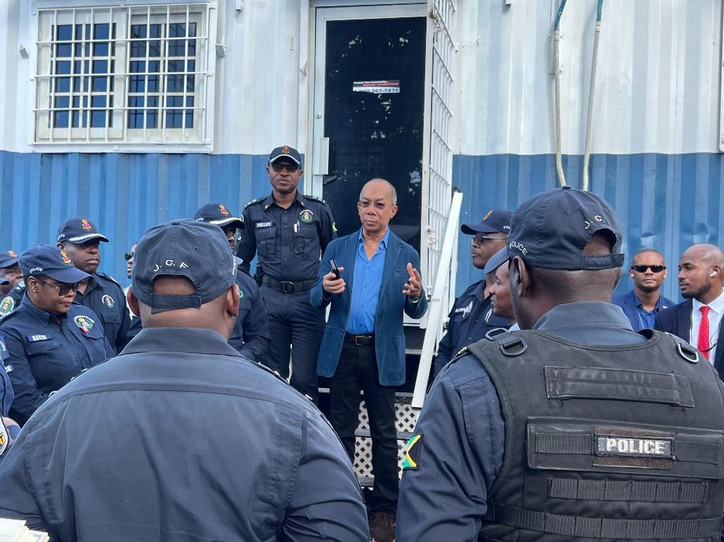 Deputy Prime Minister and Minister of National Security, the Hon. Dr. Horace Chang addresses members of the Jamaica Constabulary Force after touring the Gregory Park Mobile Police Post in Portmore, St. Catherine on December 4. He was accompanied by Acting Deputy Commissioner of Police, Warren Clarke, Acting Assistant Commissioner of Police in charge of Area 5, Christopher Phillips and other senior officers.