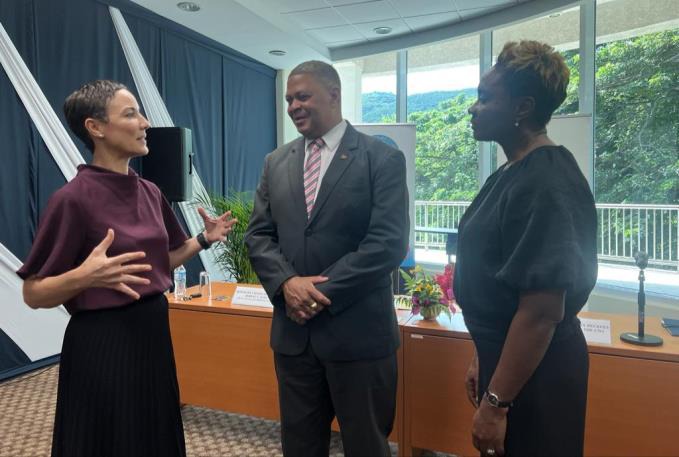 Minister of State in the Ministry of National Security, the Hon. Juliet Cuthbert-Flynn (right) engages in a discussion with Minister of Foreign Affairs and Foreign Trade, Senator the Hon. Kamina Johnson Smith and Dean Consular Corps of Jamaica, Honorary Consul General Robert Scott at the Signing Ceremony for the Memorandum of Understanding between the University of the West Indies and the Consular Corps of Jamaica at the UWI Regional Headquarters in Kingston yesterday (December 14).The MOU will aid in train
