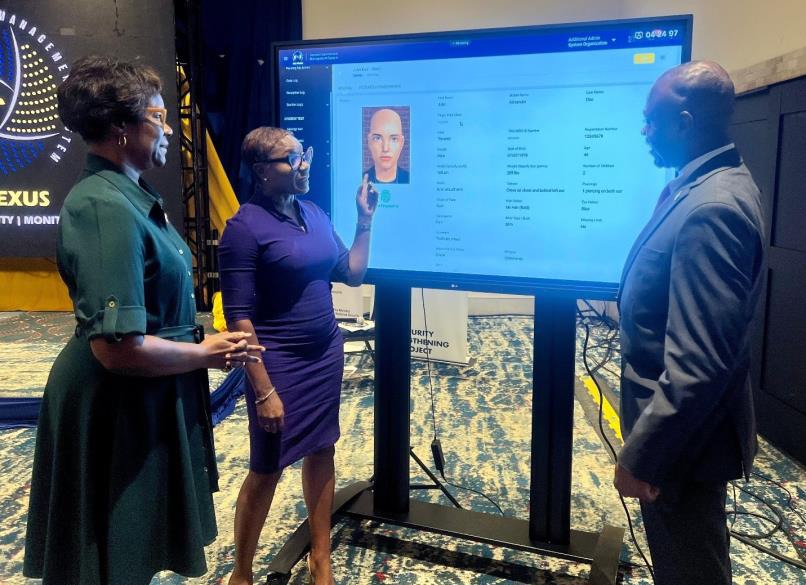 Minster of State in the Ministry of National Security, the Hon. Juliet Cuthbert-Flynn (centre), shares a point with the Permanent Secretary in the Ministry of National Security, Ambassador Alison Stone Roofe and Commissioner of Corrections Brigadier (Ret’d) Radgh Mason while referencing the new Correction Management System (CMS), which was launched at the Pegasus Hotel in Kingston on Friday (September 27).