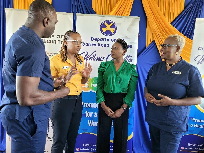 Minister of State in the Ministry of National Security, the Hon. Juliet Cuthbert-Flynn (second right) converses with Chairman of the Department of Correctional Services Wellness Committee, Nadria Brown (second left) at the launch for the 15th staging of the DCS Wellness Committee Health Fairs today (February 6) at the St. Catherine Adult Correctional Centre Sports Club. Looking on are Rehabilitation Manager at the St. Catherine Adult Correctional Centre, Beverley Baugh and Corporal Glenford Francis from the