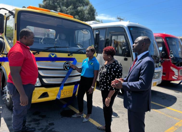 Minister of State in the Ministry of National Security, the Hon. Juliet Cuthbert-Flynn (third right) engages in a discussion with Acting Corporal, Kemar Dacres of the Department of Correctional Services Transport Unit at the Commissioning Ceremony for 12 new vehicles today (April 19) at the Tower Street Adult Correctional Centre. The high-end vehicles are valued at approximately $97 million. Looking on are Commissioner of Corrections, Brigadier (Ret’d) Radgh Mason and Chief Technical Director in the Ministr