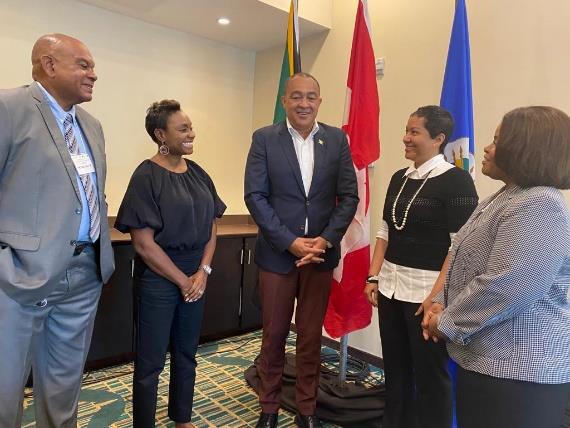 Minister of State in the Ministry of National Security Hon. Juliet Cuthbert-Flynn engage Minister of Health Dr. Christopher Tufton, Executive Director National Council on Drug Abuse (NCDA) Mr. Michael Tucker (left), Resident Representative OAS Jeanelle Van Glaanenweygel and Chief Technical Director at the Ministry of Justice Kayla Sewell Mills (right) in a light-hearted conversation at the Early Warning Systems on Drug Workshop at Courtyard by Marriot Hotel in Kingston today.