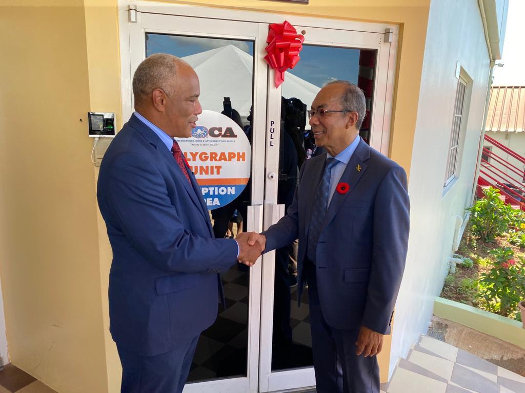 Photo Caption: Deputy Prime Minister and Minister of National Security, the Hon. Dr. Horace Chang congratulates Col. Desmond Edwards, Director General, Major Organised Crime and Anti-Corruption Agency (MOCA) on the launch of the MOCA Polygraph Examiners’ Course. The ceremony was held at the National Police College of Jamaica in Twickenham Park, St. Catherine.