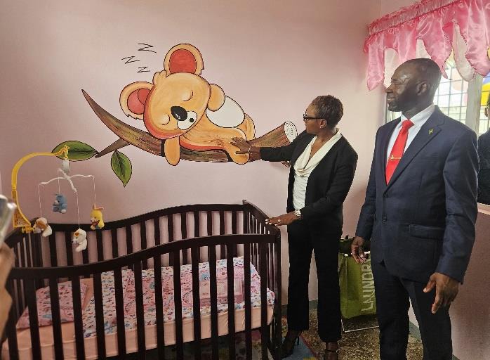 Minister of State in the Ministry of National Security, the Hon. Juliet Cuthbert-Flynn shares a moment with Commissioner of Corrections, Brigadier (Ret’d) Radgh Mason, while examining the creative artwork in one of the three rooms of the newly constructed state-of-the-art nursery at the South Camp Adult Correctional Centre in Kingston during a tour of the facility earlier today (September 24). The nursery was constructed at an estimated cost of $13 million.