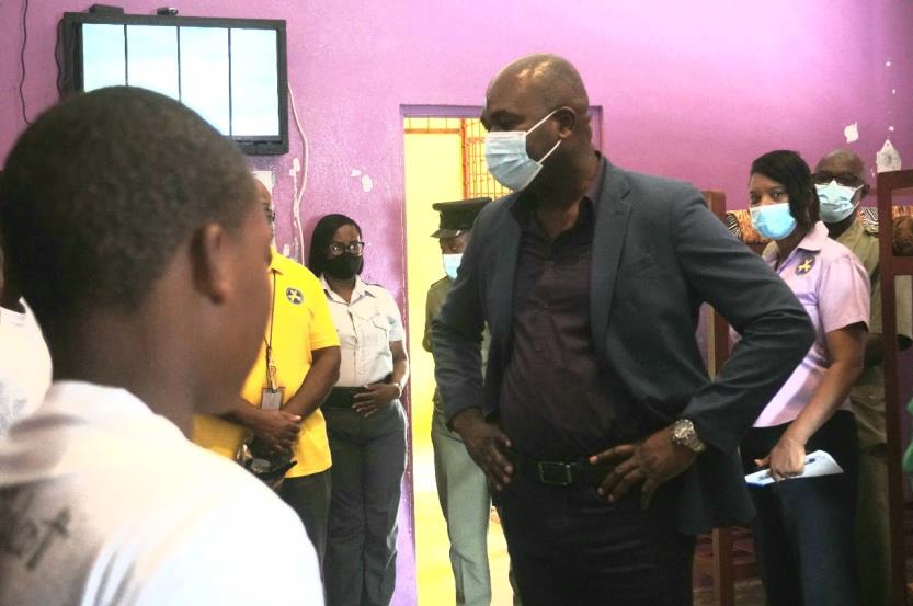 Photo Caption: Minister of State in the Ministry of National Security, the Hon. Zavia Mayne speaks with boys at the Rio Cobre Juvenile Correctional Centre during a tour of the facility yesterday (July 14, 2022).